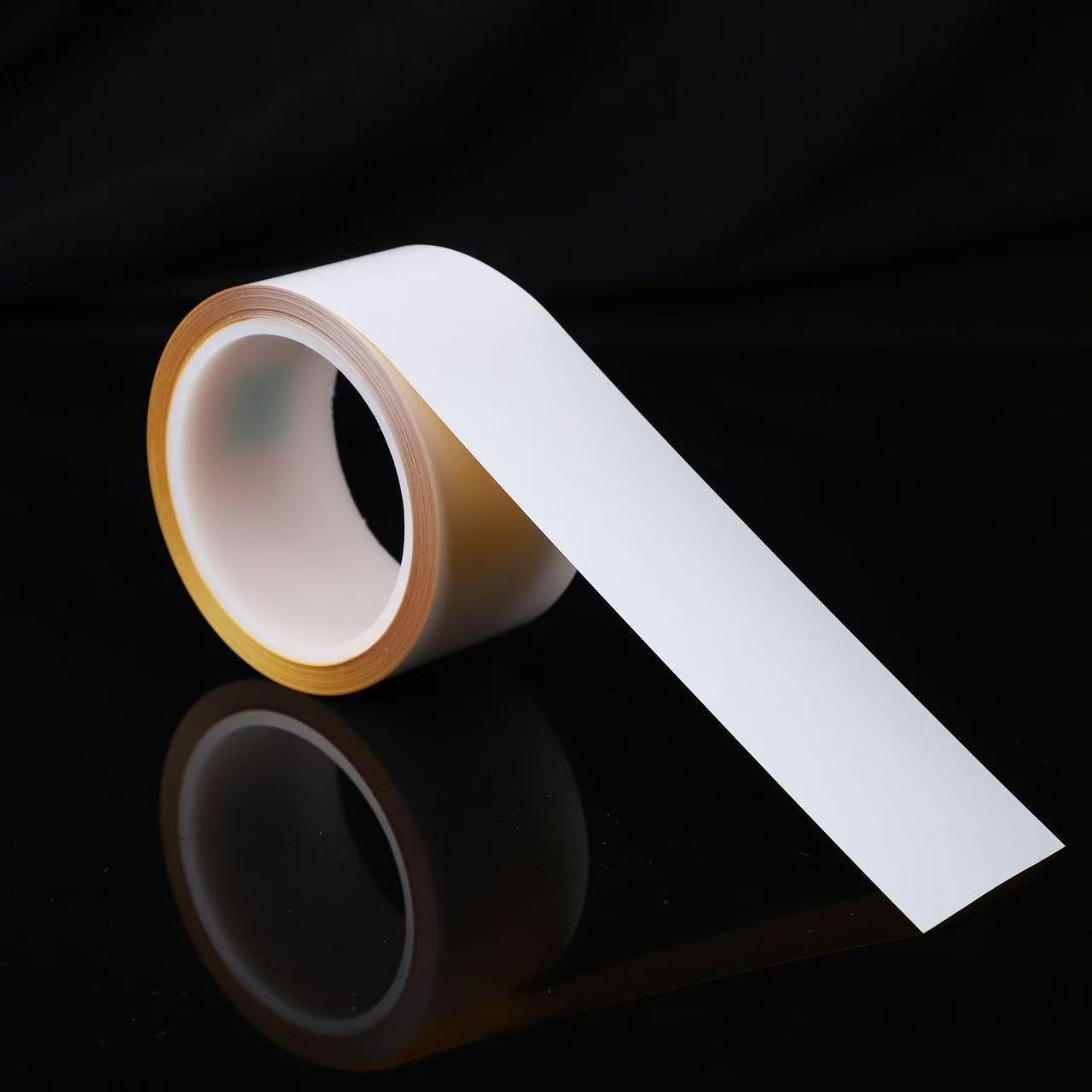 White polyimide label material with an unwound printable strip